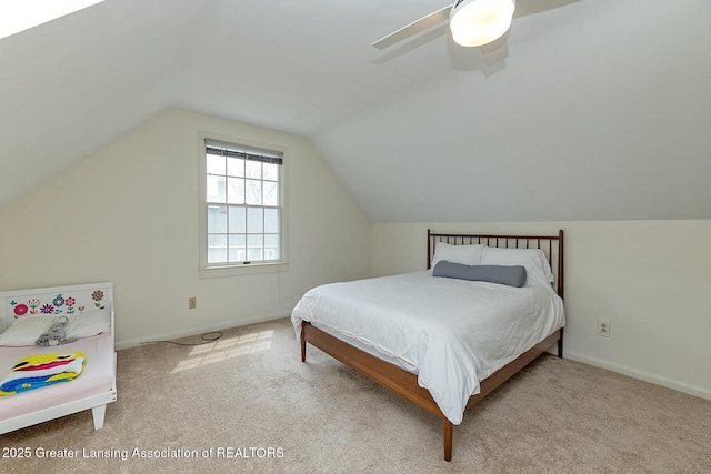 bedroom featuring vaulted ceiling, a ceiling fan, and carpet flooring