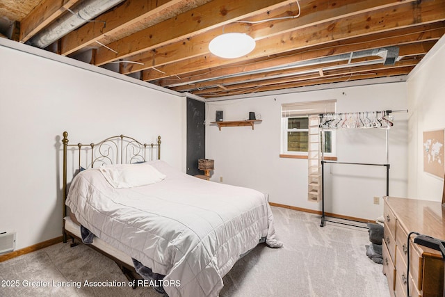 bedroom featuring baseboards and visible vents