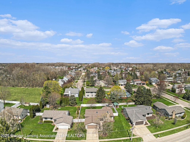 birds eye view of property with a residential view