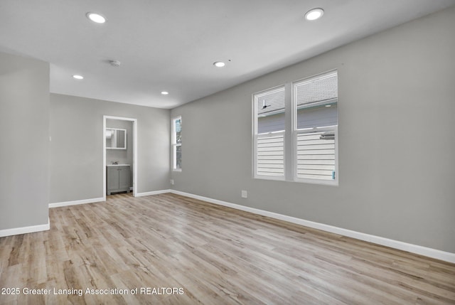 1435 New York Ave, Lansing, MI 48906 - empty room with light wood-style floors, baseboards, and recessed lighting