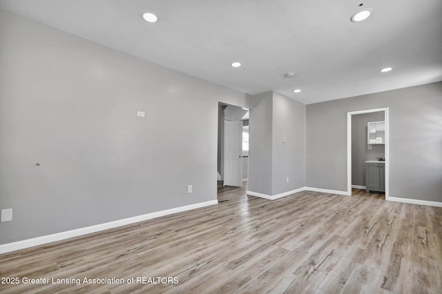1435 New York Ave, Lansing, MI 48906 - empty room with light wood-style floors, baseboards, and recessed lighting