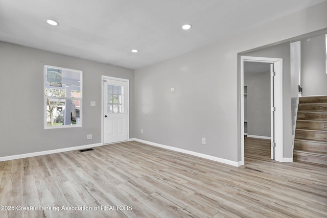 1435 New York Ave, Lansing, MI 48906 - interior space with light wood finished floors, recessed lighting, baseboards, visible vents, and stairway