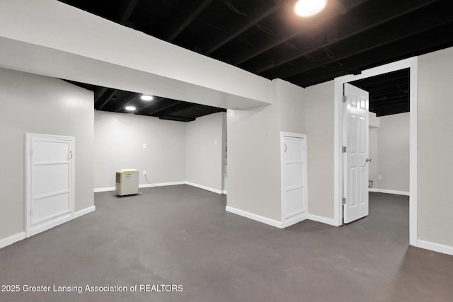 1435 New York Ave, Lansing, MI 48906 - finished basement featuring baseboards and dark carpet