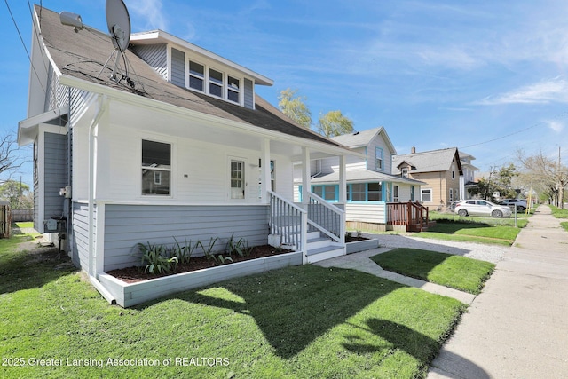 1435 New York Ave, Lansing, MI 48906 - bungalow-style house featuring a front yard