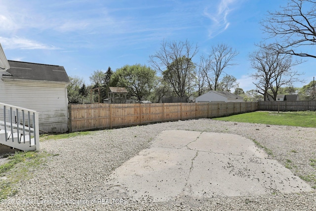1435 New York Ave, Lansing, MI 48906 - view of yard featuring a fenced backyard and a patio area