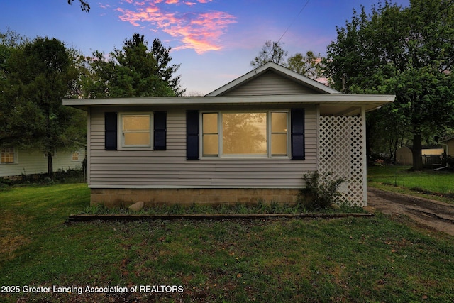 218 W Thomas St, Lansing, MI 48906 - view of home's exterior featuring a yard