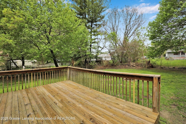 218 W Thomas St, Lansing, MI 48906 - deck featuring a lawn and a fenced backyard