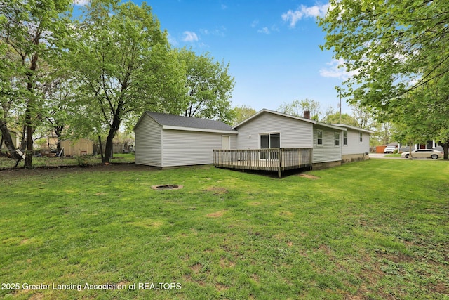218 W Thomas St, Lansing, MI 48906 - back of house featuring a deck and a lawn