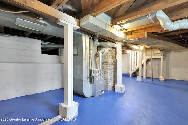 218 W Thomas St, Lansing, MI 48906 - unfinished basement with stairs and heating unit