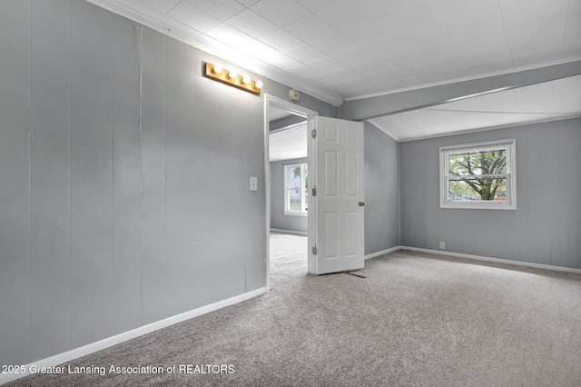218 W Thomas St, Lansing, MI 48906 - carpeted empty room with a wealth of natural light and ornamental molding