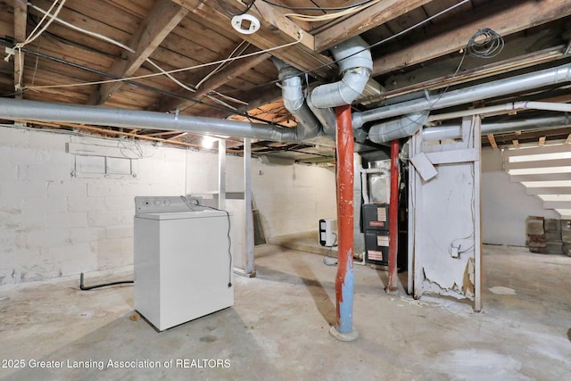 425 Filley St, Lansing, MI 48906 - unfinished below grade area featuring washer / clothes dryer and heating unit