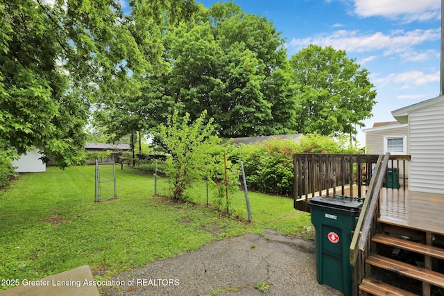 425 Filley St, Lansing, MI 48906 - view of yard featuring a deck