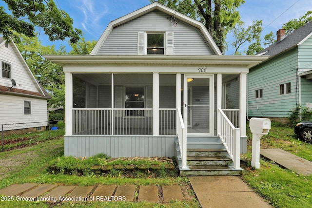908 Larned St, Lansing, MI 48912 - dutch colonial with a gambrel roof and a sunroom