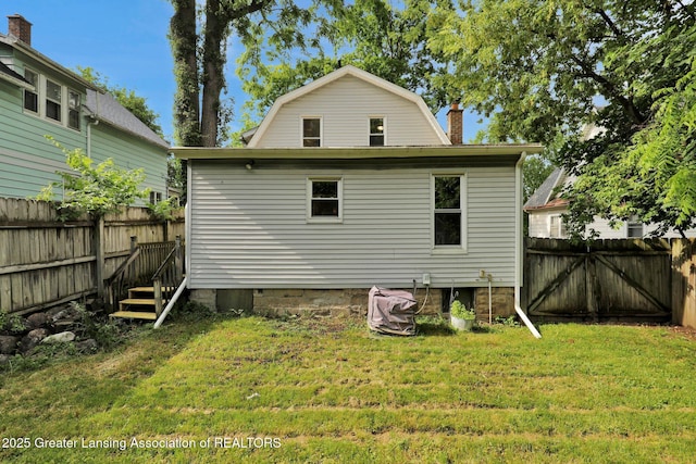 908 Larned St, Lansing, MI 48912 - rear view of property featuring a gambrel roof and a chimney