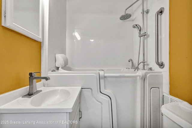 908 Larned St, Lansing, MI 48912 - full bath featuring toilet, vanity, and a shower