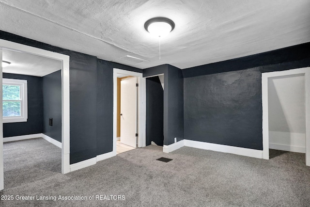 908 Larned St, Lansing, MI 48912 - carpeted empty room with baseboards