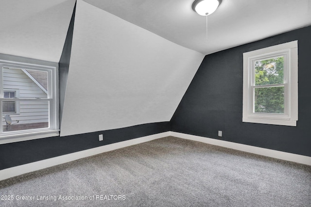 908 Larned St, Lansing, MI 48912 - bonus room featuring carpet floors, baseboards, and lofted ceiling