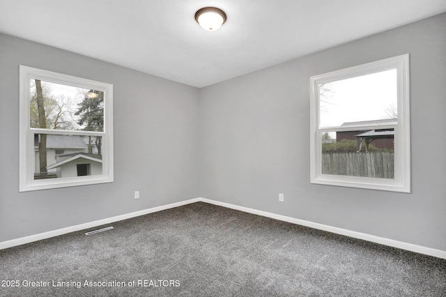 2619 Schippell St, Holt, MI 48842 - carpeted spare room featuring baseboards and visible vents
