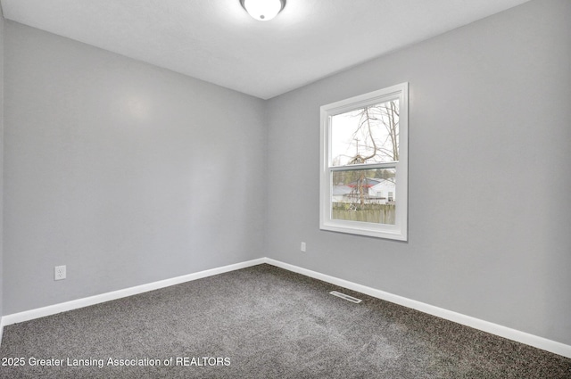 2619 Schippell St, Holt, MI 48842 - empty room with baseboards, carpet flooring, and visible vents