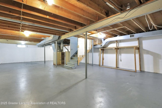 2619 Schippell St, Holt, MI 48842 - unfinished below grade area with stairs and visible vents