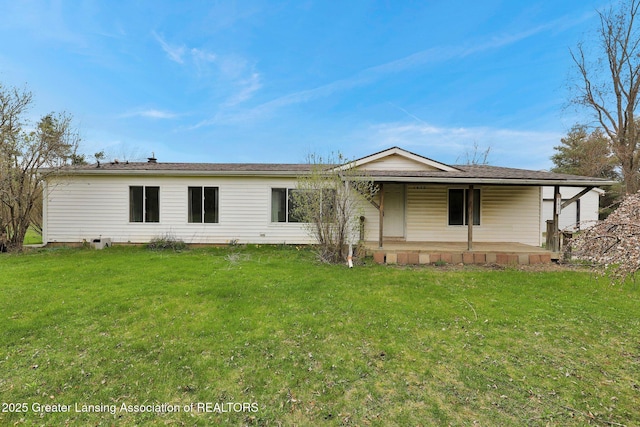 view of front of property with a front yard and covered porch