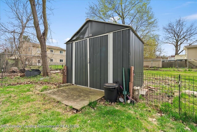 view of shed featuring fence