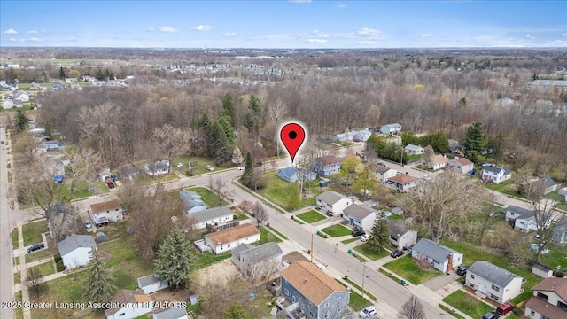 aerial view with a residential view and a view of trees