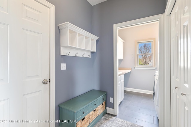 12714 Ospreys Way, Dewitt, MI 48820 - mudroom featuring tile patterned floors and baseboards