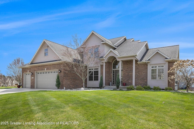 12714 Ospreys Way, Dewitt, MI 48820 - view of front of house with a front yard, brick siding, and a garage