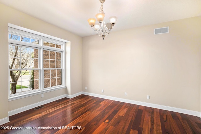 12714 Ospreys Way, Dewitt, MI 48820 - unfurnished room with an inviting chandelier, visible vents, and baseboards