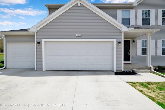 12001 Bryde Dr, Rives Junction, MI 49277 - traditional home featuring a garage and driveway