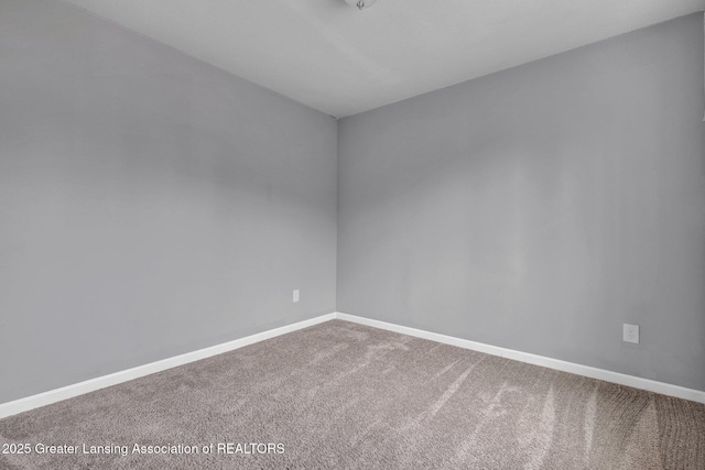 12001 Bryde Dr, Rives Junction, MI 49277 - carpeted spare room featuring baseboards