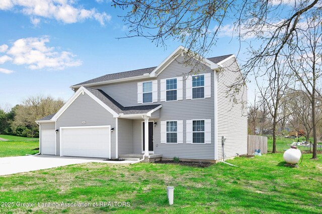 12001 Bryde Dr, Rives Junction, MI 49277 - traditional-style home with an attached garage, roof with shingles, a front yard, and concrete driveway