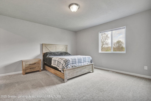 12001 Bryde Dr, Rives Junction, MI 49277 - bedroom featuring baseboards, carpet flooring, and visible vents