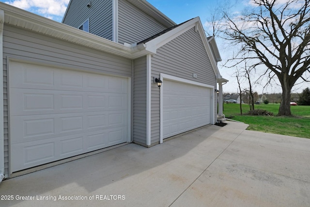 12001 Bryde Dr, Rives Junction, MI 49277 - view of side of home with concrete driveway