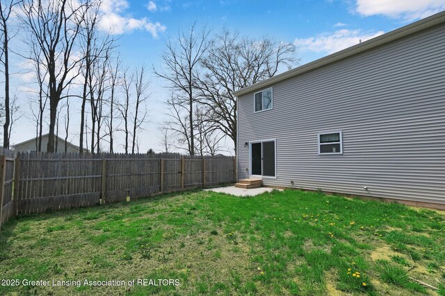 12001 Bryde Dr, Rives Junction, MI 49277 - back of property with a fenced backyard and a yard