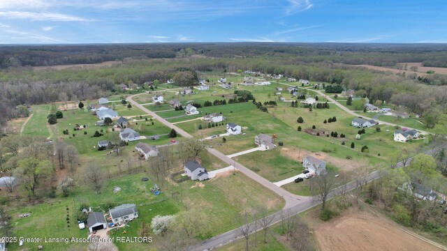12001 Bryde Dr, Rives Junction, MI 49277 - drone / aerial view with a forest view