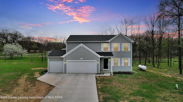 12001 Bryde Dr, Rives Junction, MI 49277 - traditional-style house featuring concrete driveway, a shingled roof, a front lawn, and a garage