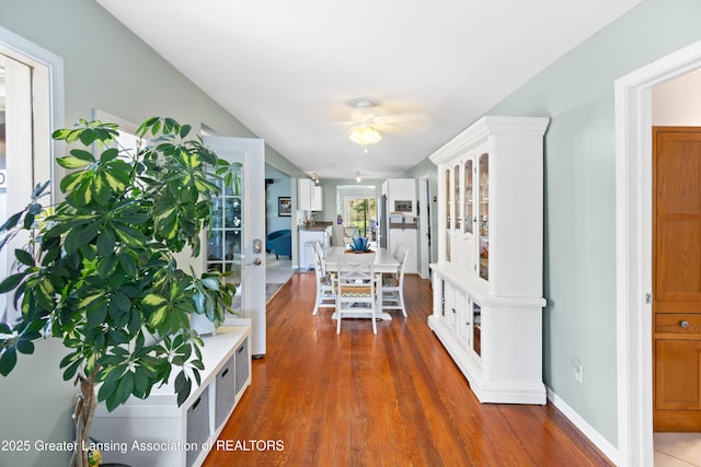 dining room featuring wood finished floors and a ceiling fan