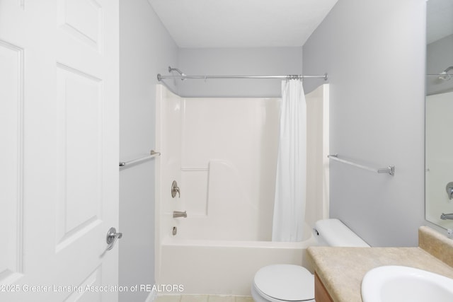 bathroom with vanity, shower / bath combo, and toilet