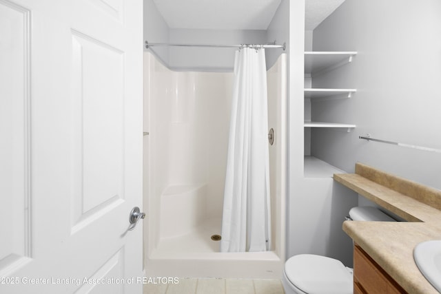 full bath featuring vanity, tile patterned floors, a shower stall, and toilet