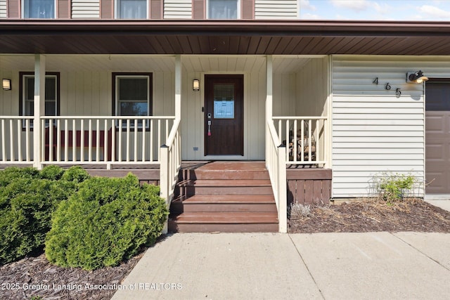 doorway to property featuring covered porch