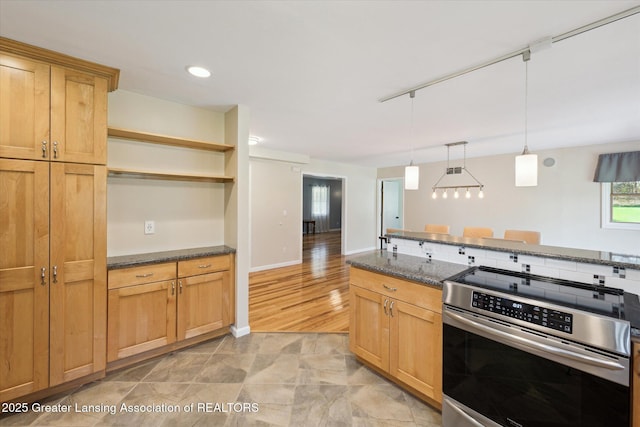 kitchen with stainless steel electric range oven, open shelves, hanging light fixtures, dark stone counters, and baseboards