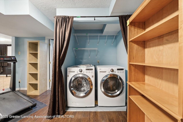 laundry room featuring laundry area, dark wood-style flooring, and independent washer and dryer