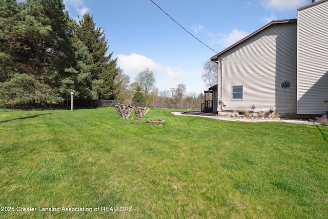 view of yard featuring fence