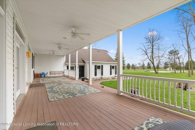 1785 N Williamston Rd, Williamston, MI 48895 - wooden deck with ceiling fan and a yard