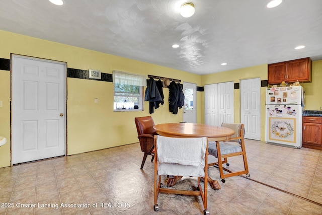dining room with recessed lighting
