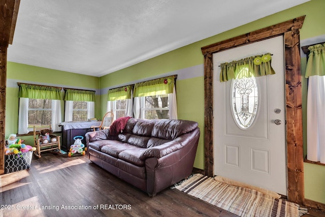 living area with a wealth of natural light and wood finished floors