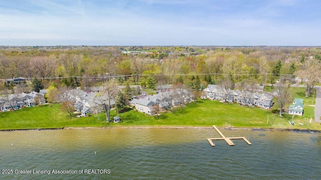 drone / aerial view with a water view and a residential view