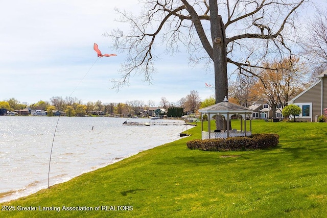 exterior space featuring a gazebo and a water view